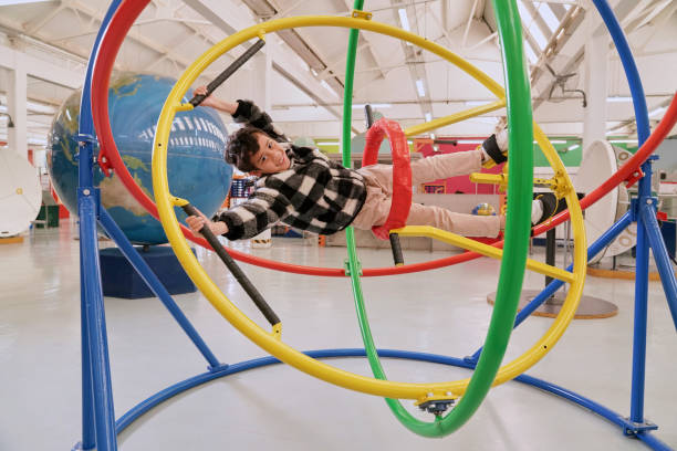 istock Boy having fun on gyroscope at science center 2194166860