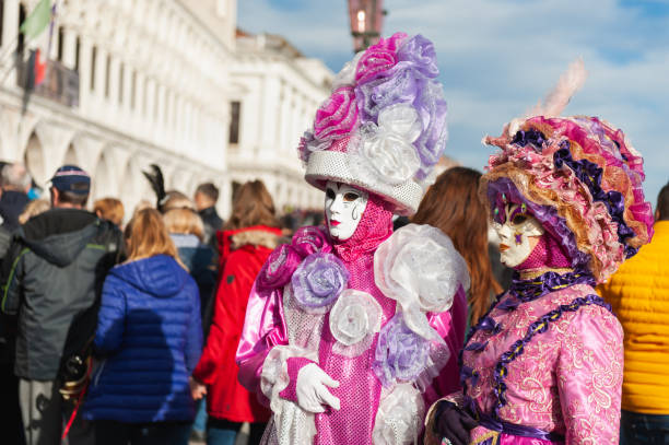 Venice, Italy - February, 15, 2020: Traditional Venice Carnival in Venice, Italy. People wearing masks and colorful costumes at the carnival