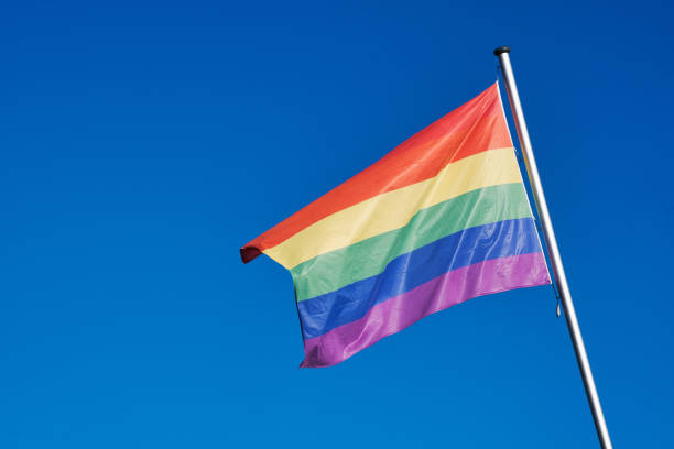 istock Rainbow ride in the wind against blue sky 2194168586
