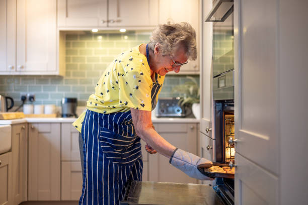 istock Elderly Woman Baking Cookies 2194170415