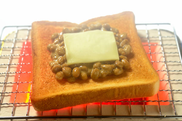 Place natto on bread and grill it on a charcoal grill.
