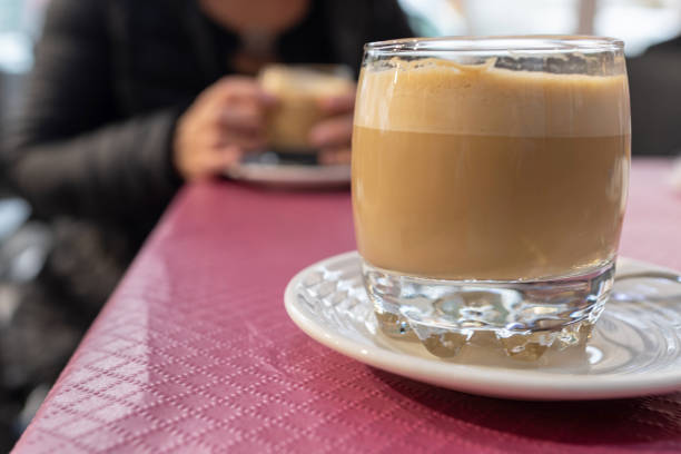 istock Having a coffee with milk in a glass 2194170798