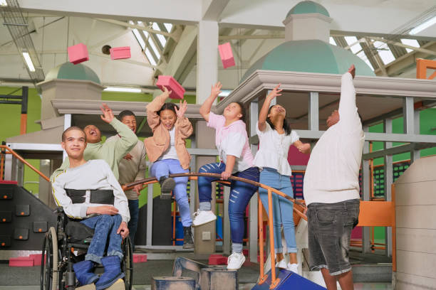 istock Cheerful teenagers throwing blocks in science center 2194171207