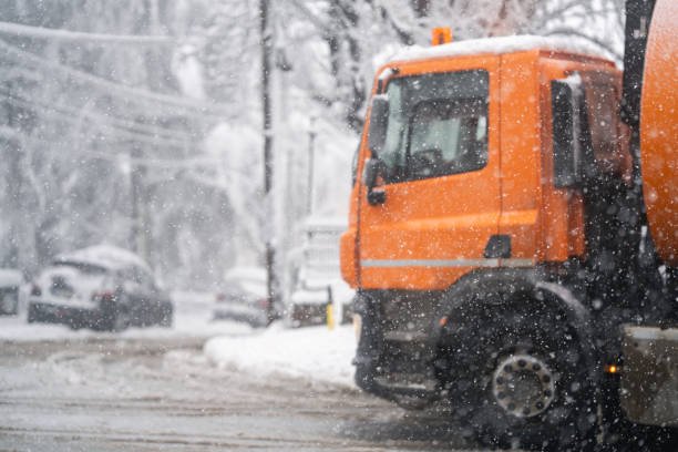 Garbage truck on a snowy winter street.