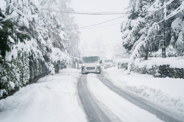 istock Delivery van on a snow covered winter road during snowstorm. 2194173778