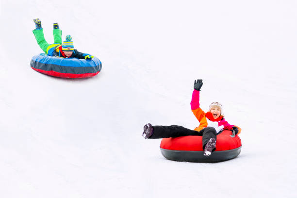 istock Kids Winter Snowtubing 2194175021