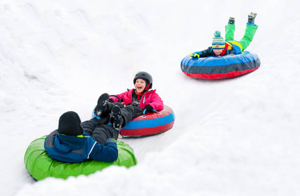 istock Kids Winter Snowtubing 2194175047