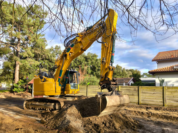 istock Leveling the ground for laying new asphalt 2194176706