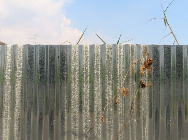 The corrugated iron fence is installed in a private area The corrugated iron fence is installed in a private area, Bangkok, Thailand. corrugated metal fence ideas stock pictures, royalty-free photos & images