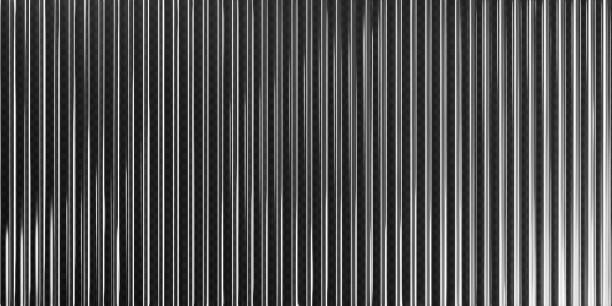 istock 3d transparent ribbed glass background with refraction effect. Reeded glass with black and white gradient. Render of corrugated wall with overlay reflection light on dark. 3d vector background 2194177157