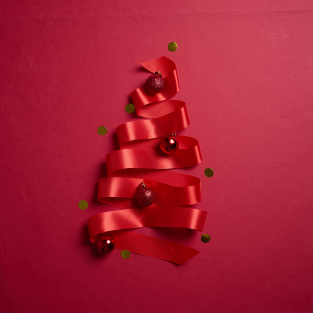istock Christmas tree made of red ribbons on red background, element for design with copy space for text or image 2194179942