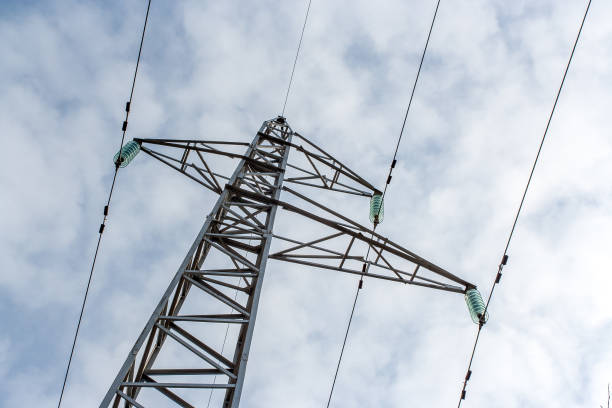istock Electric pole viewed from below towards the sky 2194180267