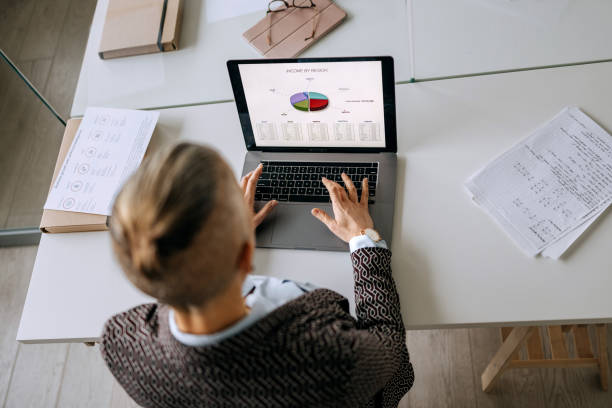 istock Well dressed businesswoman using laptop at the modern office 2194180868