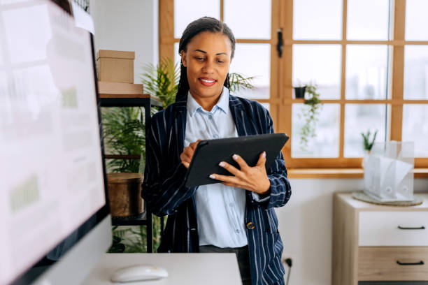 istock Well dressed businesswoman using digital tablet at the modern office 2194180889