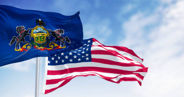 istock Pennsylvania state flag waving with the american flag 2194181490