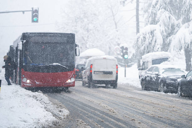 istock City bus on a city street during snowfall. 2194183204