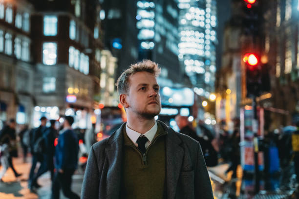 istock Businessman walking in london at night 2194183524
