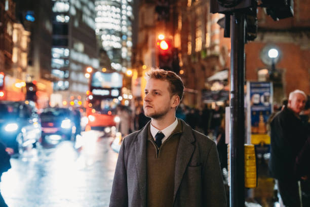 istock Businessman walking in london at night 2194183529