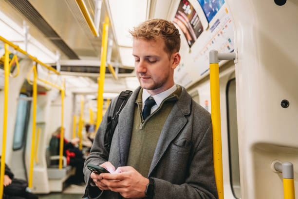 istock Businessman using smartphone on London Underground 2194183599
