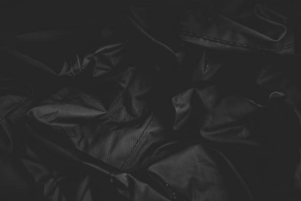 istock wrinkled black texture and background close up 2194186748