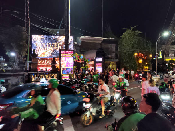 Crowded street at night in Seminyak, a famous tourist area on the west coast of Bali, Indonesia