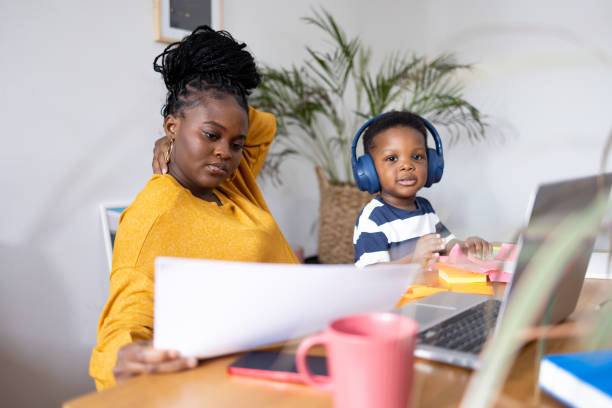 istock Mother working from home with her son playing near 2194188897