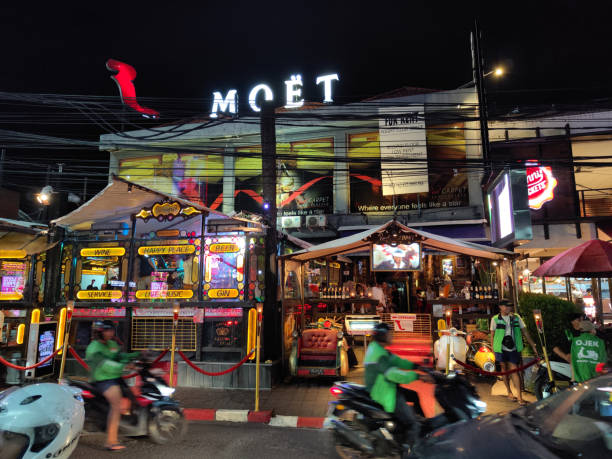 Crowded street at night in Seminyak, a famous tourist area on the west coast of Bali, Indonesia