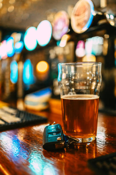 istock Beer and car keys at the bar counter, drunk driving concept 2194190136