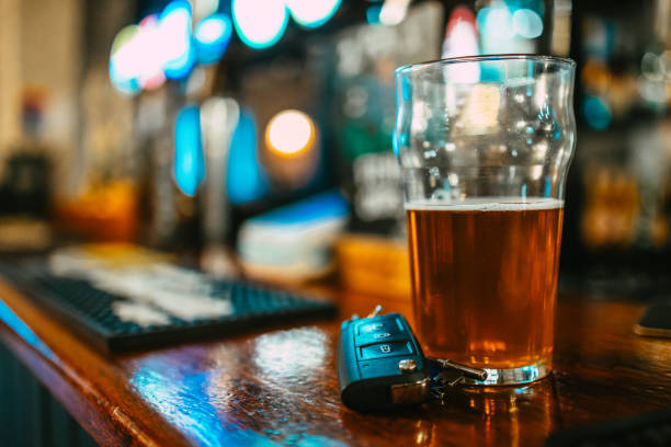 istock Beer and car keys at the bar counter, drunk driving concept 2194190137