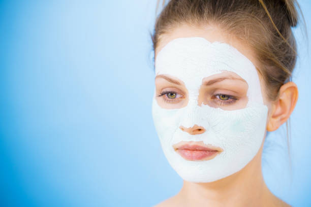istock Girl with dry white mud mask on face 2194191560