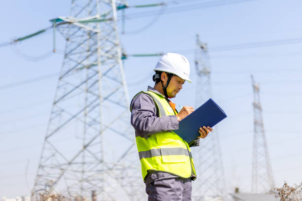 istock Power engineer working in front of high voltage electricity tower 2194193071