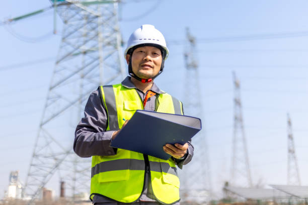 istock Power engineer working in front of high voltage electricity tower 2194193091