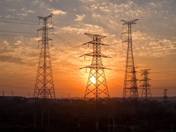 istock Sunset silhouette of high voltage transmission lines 2194193470