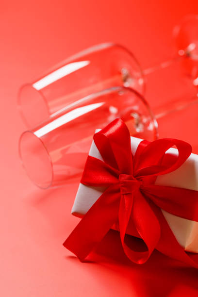 istock A wine glasses elegantly paired with a Valentine's Day gift box 2194194992