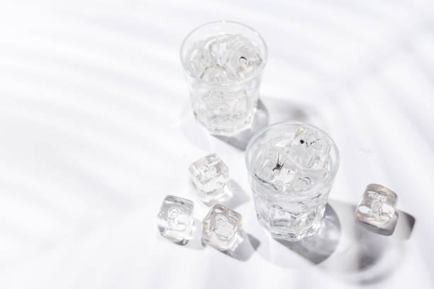 istock Crystal-clear glasses filled with chilled water and ice cubes 2194195036