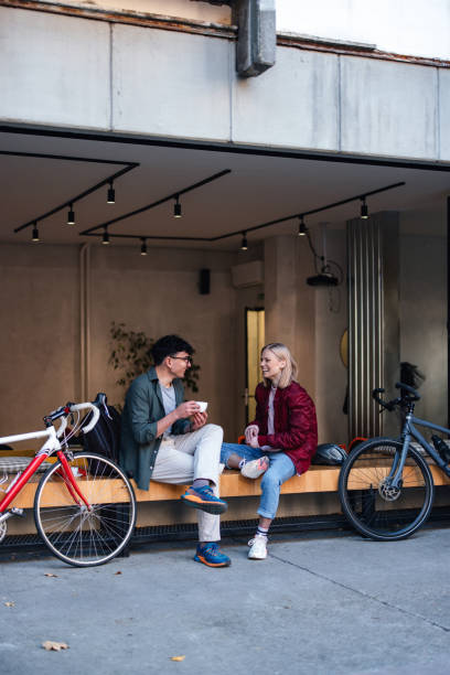 istock Friends Enjoying Coffee and Conversation Outside a Modern Cafe 2194195484
