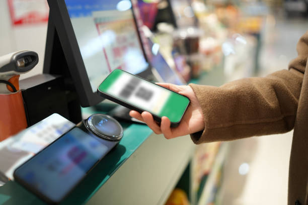 istock Modern Mobile Payment at Grocery Store Checkout Counter 2194196172