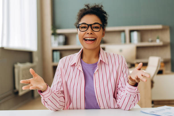 istock Cheerful businesswoman making video call and talking with customers 2194199843
