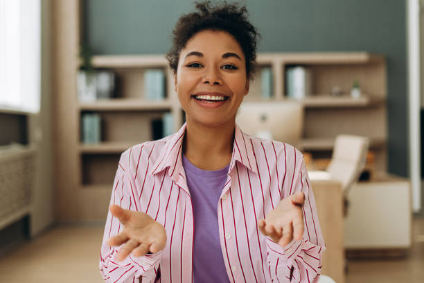 istock Smiling woman making a video call from home office 2194199850