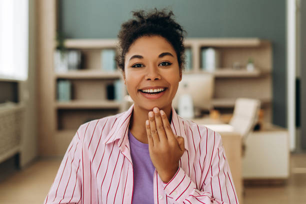 istock Surprised young woman gesturing shock and excitement in home office 2194199869