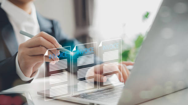 istock E-invoice and online digital statements concept. Businessmen using computer laptops with invoice icons on virtual screens, e-tax, and digital receipts. 2194202195