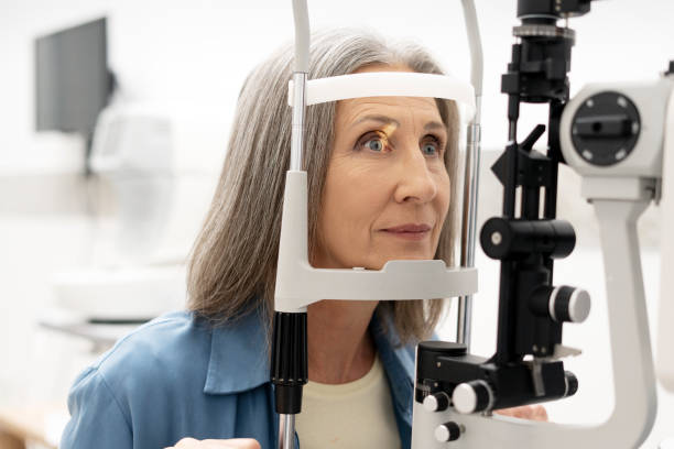 istock Senior woman undergoing eye examination with slit lamp biomicroscope 2194206987