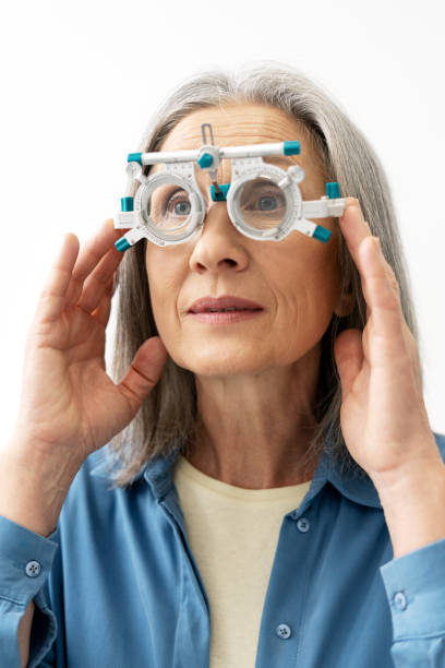 istock Senior woman undergoing eye exam with phoropter for vision correction 2194207044