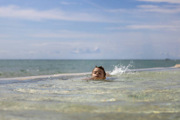 istock Beach Vacation: Person Swimming in Tranquil Sea 2194210048