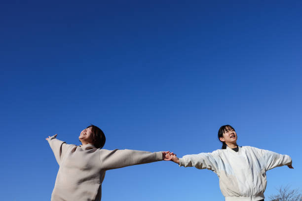 istock Japanese mother and daughter interact outside 2194212797