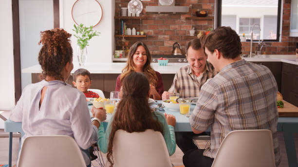 istock Multi Generation Family Enjoying Meal Around Table At Home 2194213373