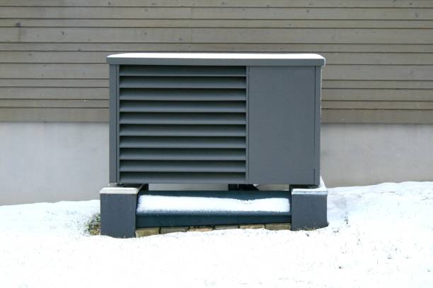 istock Heat pump in front of a house facade. Modern, climate friendly heating. 2194215433
