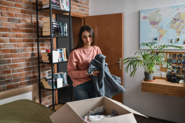 istock Sad Female Putting Clothes Back in Package Preparing to Return Them After Receiving Wrong Order 2194215848