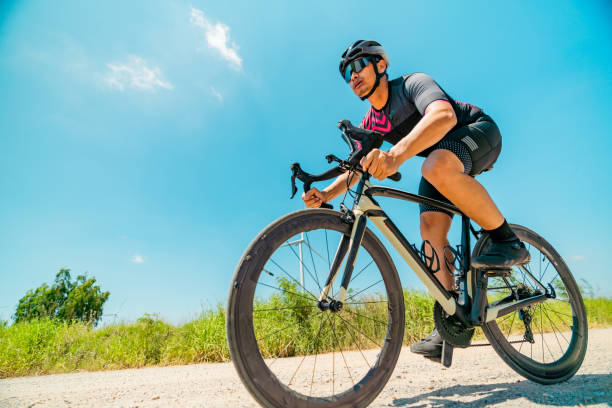 istock Biker riding on a gravel. 2194216368