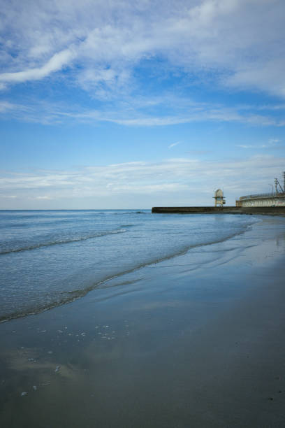 istock Beautiful early morning waves and reflections on the beach 2194216390